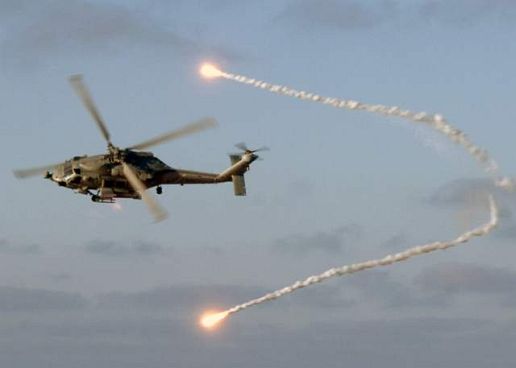 Seahawk helicopter releases flares